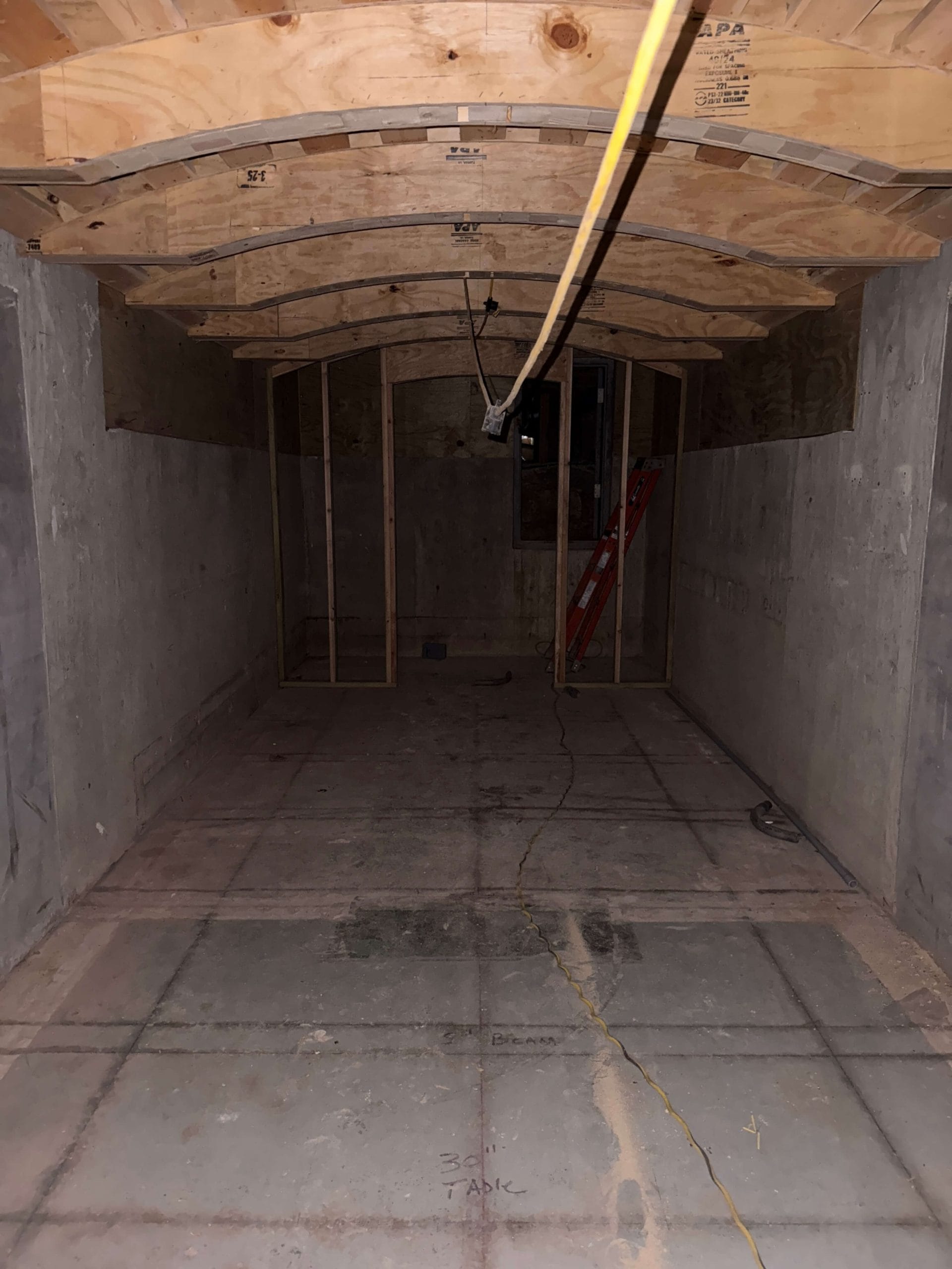 Arched ceiling framing during underground custom wine cellar construction phase