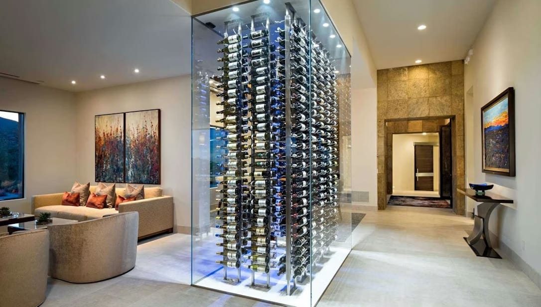 Glass-enclosed custom wine cellar installation with floor-to-ceiling bottle display in a modern residential space