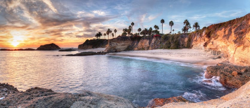 Southern California coastline at sunset representing luxury wine cellar services
