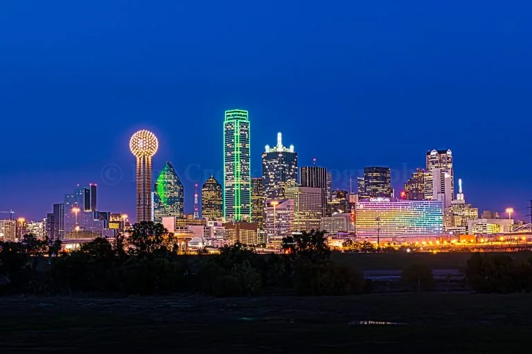 Dallas skyline at night representing custom wine cellar services in Dallas